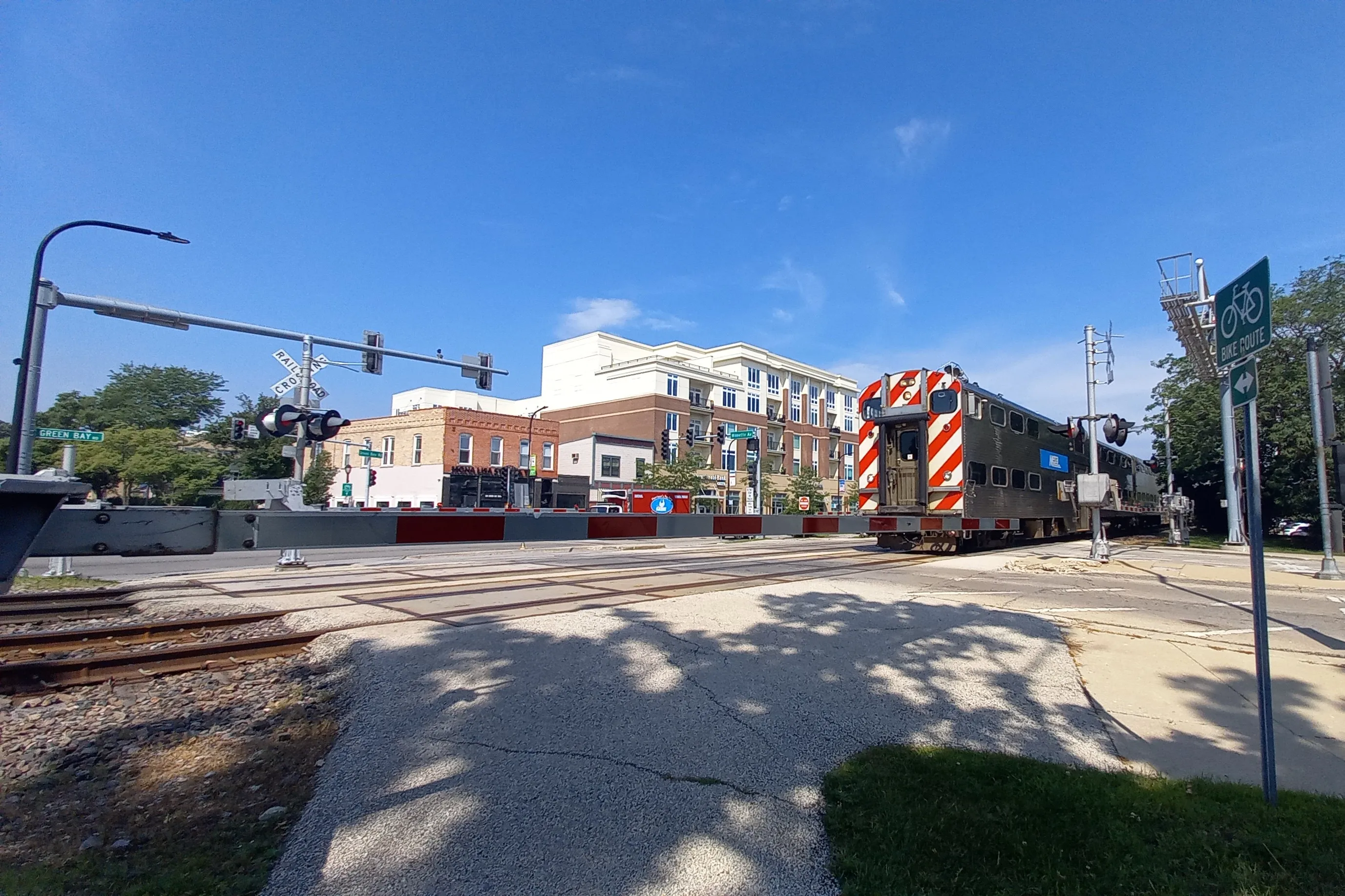 A Metra commuter train crossing Wilmette Avenue in Wilmette, Illinois, July 2025