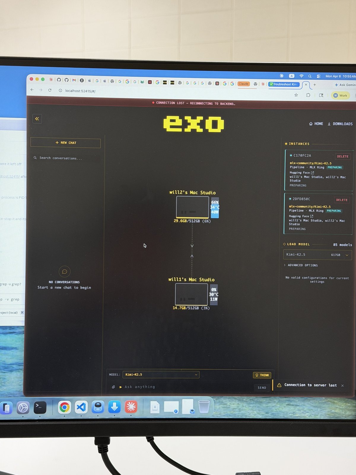 The EXO interface splitting the Kimi K2.5 model across two Mac Studios, each with 512GB of memory