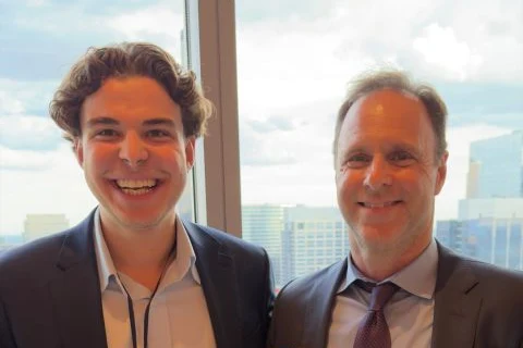 Michael Pavlovskyi in conversation with a client at a Chicago event